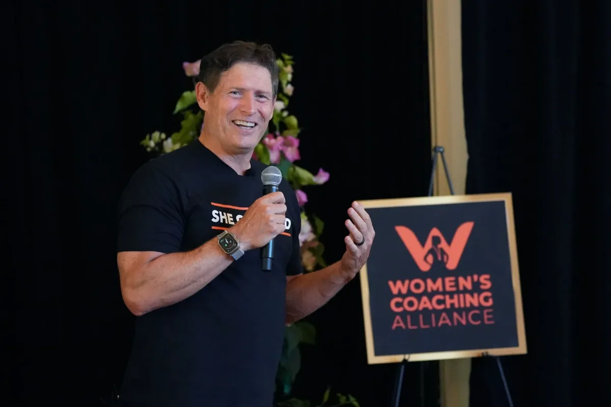 Steve Young speaking at a Women’s Coaching Alliance event